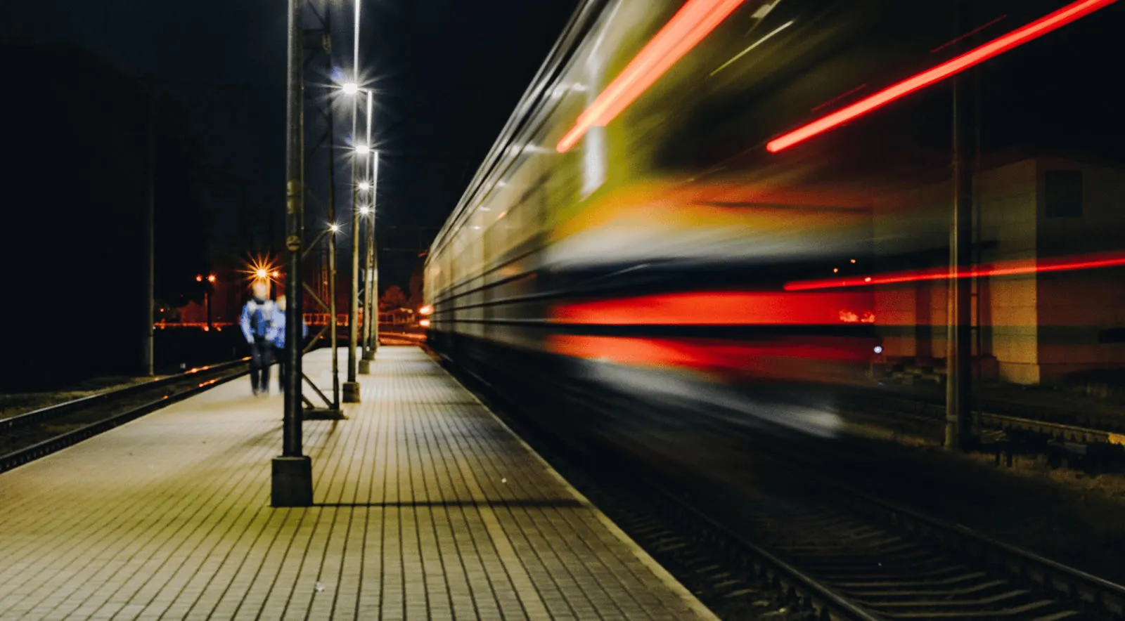 Motion blur of a train passing a station platform